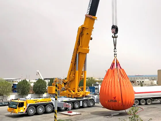 Heavy duty crane lifting a water load testing bag