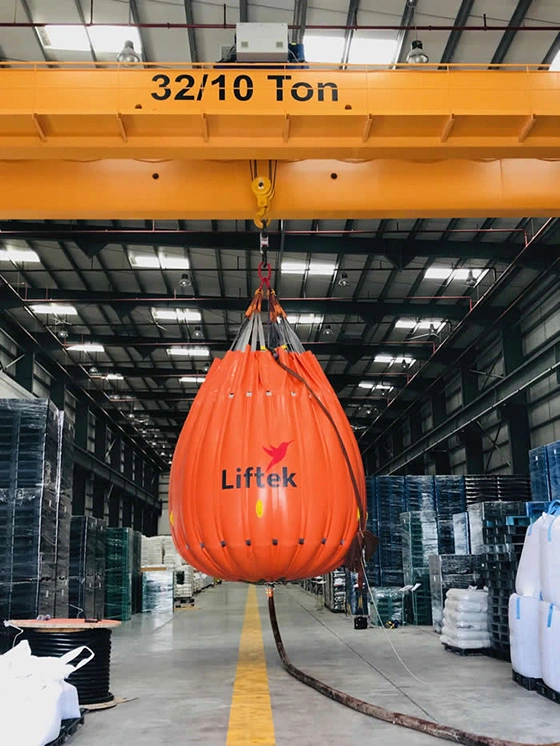 Single load bag test hanging in warehouse under crane beam