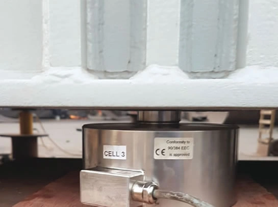 Load cell installed under structure for load measurement